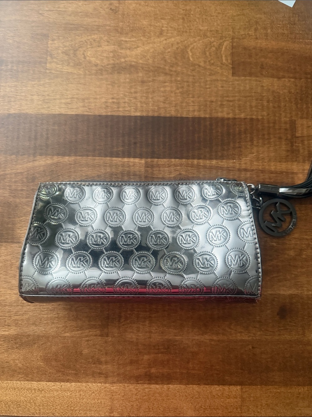 Michael Kors Metallic Silver MK Embossed Make up bag